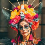 A Woman with Face Paint Wearing a Headdress